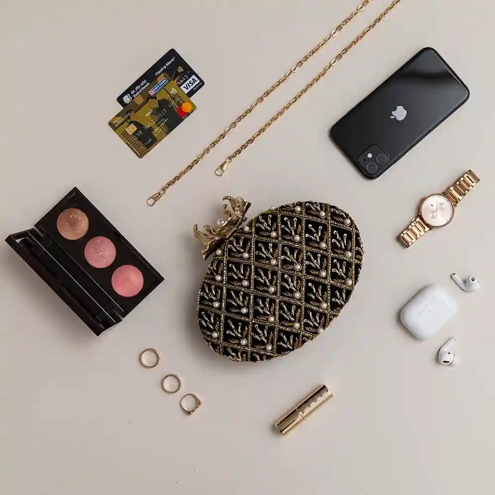 Black embroidered clutch bag by The Tan Clan with intricate hand embroidery, stylish and perfect for evening occasions.