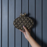 Black Zafraan hand-embroidered clutch bag with intricate embroidery, stylish accessory by The Tan Clan.