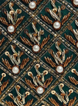 Zafraan hand-embroidered clutch bag with intricate designs, crafted by The Tan Clan, featuring traditional embroidery details.