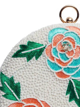 Round floral hand-embroidered clutch bag by The Tan Clan featuring intricate floral embroidery on a stylish accessory.