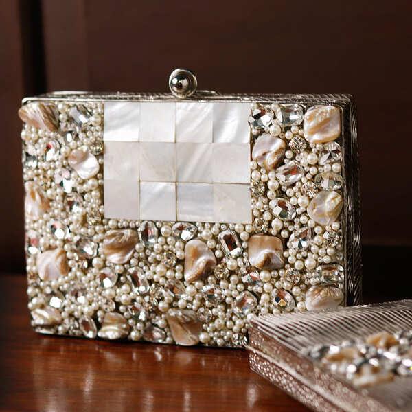 Zoya Embellished Brass Clutch by The Tan Clan, featuring intricate embellishments and a sleek brass design for elegant occasions.
