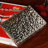 Zoya embellished brass clutch by The Tan Clan with intricate detailing and a sleek design for elegant occasions.