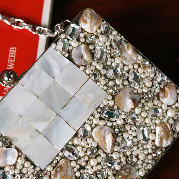 Zoya Embellished Brass Clutch by The Tan Clan featuring intricate embellishments and a sleek, stylish design for evening occasions.
