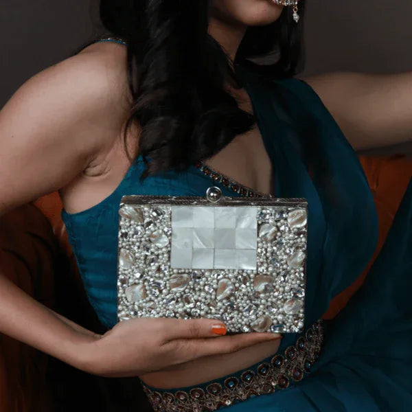 Elegant Zoya Embellished Brass Clutch with intricate detailing, showcasing a stylish accessory by The Tan Clan.