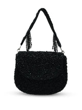 Amy black flap-over bag by The Tan Clan, stylish leather handbag with a flap closure and sleek design.