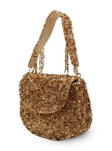 Amy Gold Flap Over Bag from The Tan Clan, stylish flap bag with gold accents, shown in a close-up image highlighting its design details.