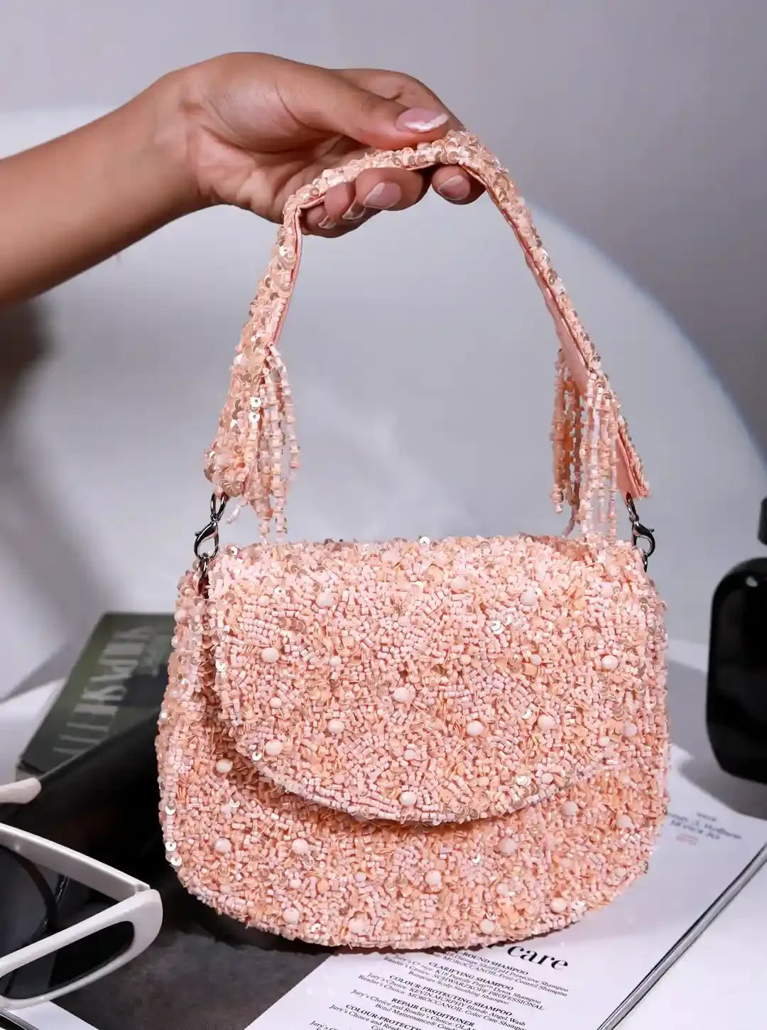 Amy Peach Flap Over Bag by The Tan Clan, stylish flap bag with a soft peach color and adjustable shoulder strap, front flap closure.