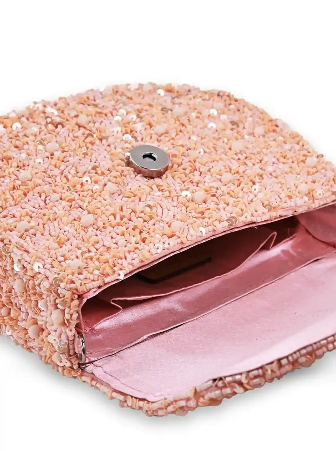 Amy Peach Flap Over Bag from The Tan Clan, stylish flap bag with a soft peach color and sleek design, visible zipper and strap details.