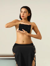 Black Claire flap-over bag by The Tan Clan, stylish and spacious flap bag with a sleek design and adjustable strap.