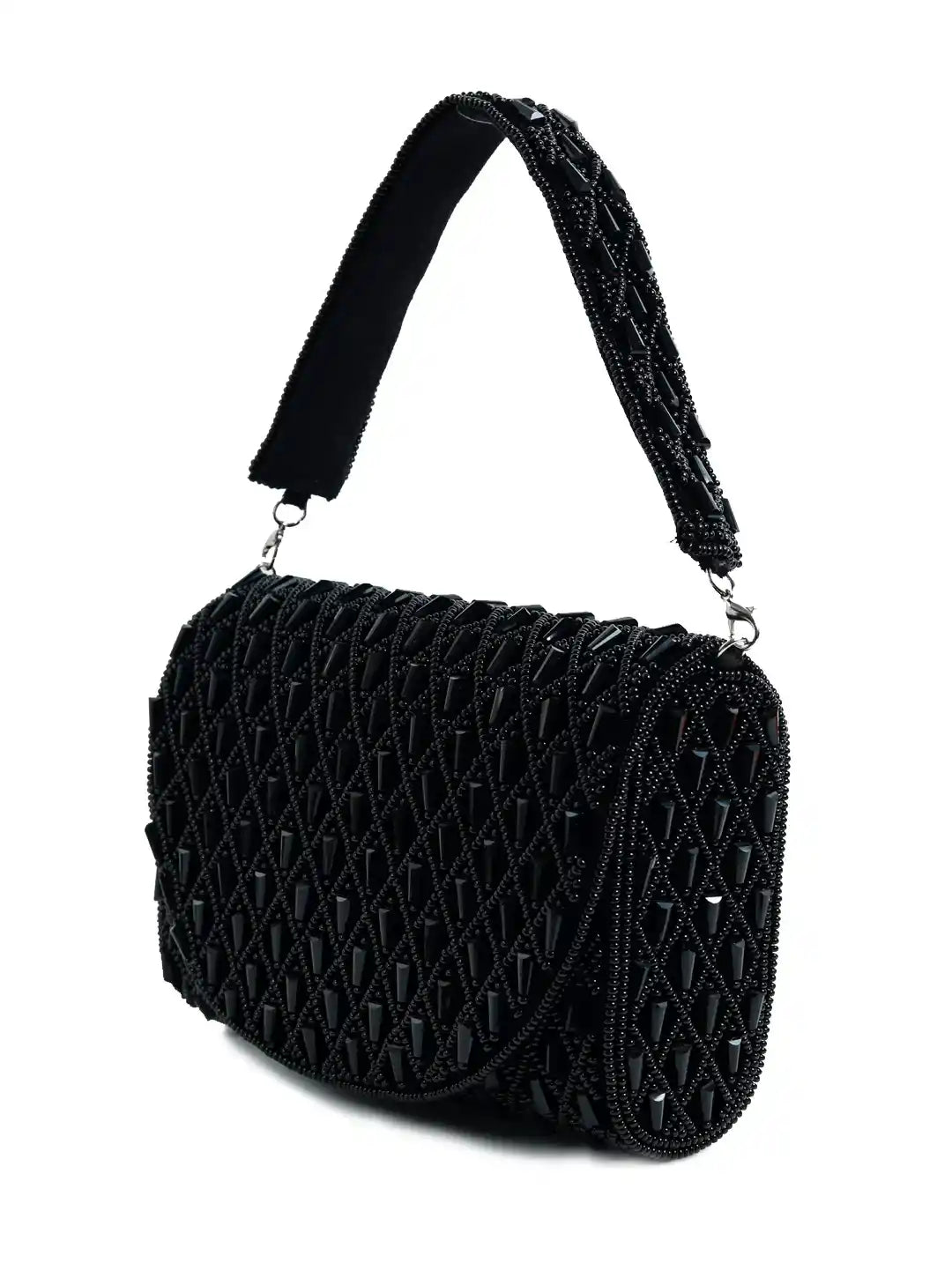 Claire Black flap-over bag from The Tan Clan, stylish leather flap bag with a sleek design and top handle for versatile carrying.