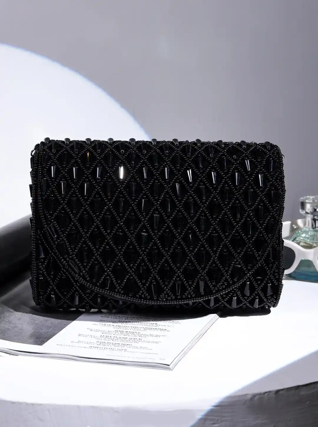 Black Claire Flap Over Bag by The Tan Clan, stylish flap bag with a sleek design and top handle, perfect for everyday use.