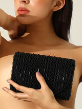 Black Claire flap over bag from The Tan Clan featuring a stylish flap design and spacious interior.