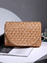 Gold flap-over bag from The Tan Clan's Claire collection, stylish leather handbag with a sleek design and top flap closure.