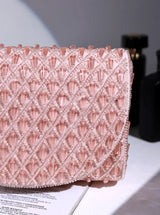 Pink Claire flap-over bag by The Tan Clan, stylish leather flap bag with a secure top closure and spacious interior.