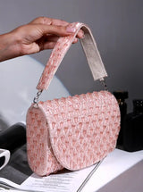 Pink flap over bag from The Tan Clan's Claire collection, stylish accessory with a structured design and flap closure.
