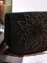 Eva black flap-over bag by The Tan Clan, stylish leather handbag with a flap closure and adjustable strap.