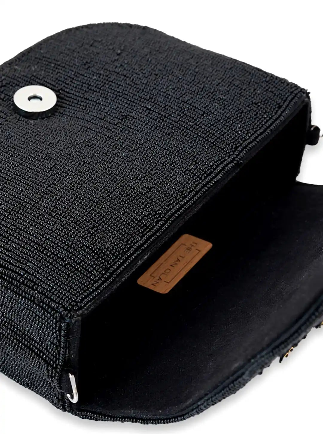 Eva Black Flap Over Bag from The Tan Clan, stylish flap bag with sleek black leather and gold-tone hardware, front flap closure.