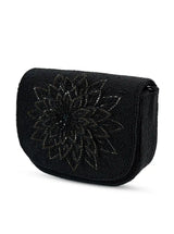 Eva Black Flap Over Bag from The Tan Clan, stylish flap bag with a sleek black design and adjustable shoulder strap.