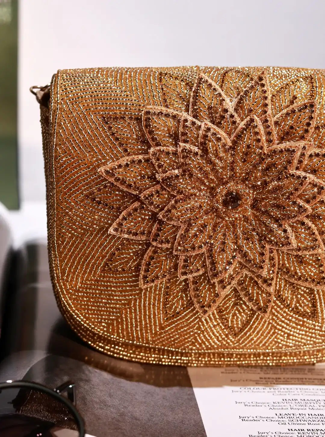 Eva Gold Flap Over Bag by The Tan Clan featuring a stylish gold flap, leather shoulder strap, and spacious interior for everyday use.