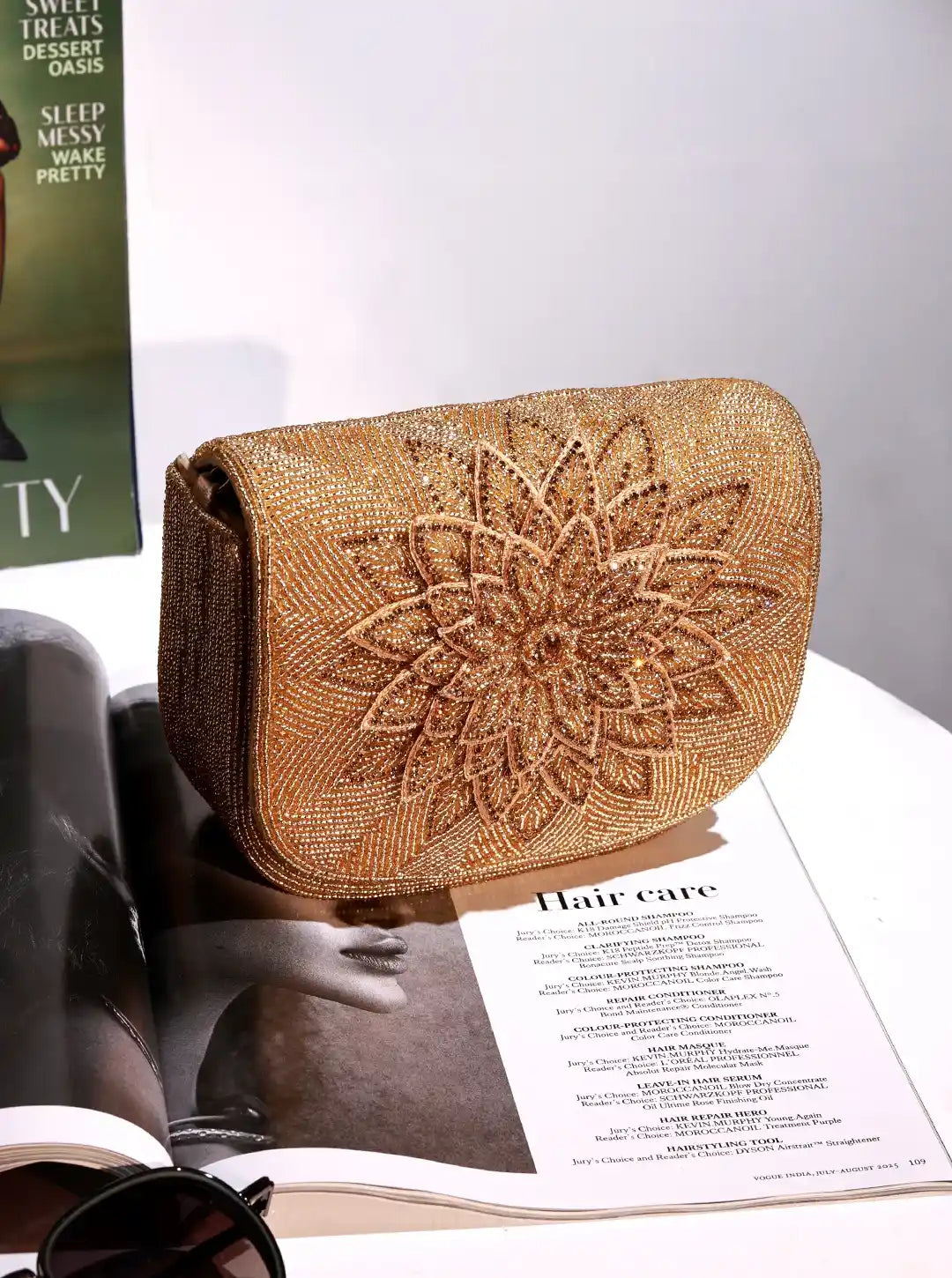 Eva Gold Flap Over Bag from The Tan Clan, stylish gold flap handbag with a sleek design and structured shape.