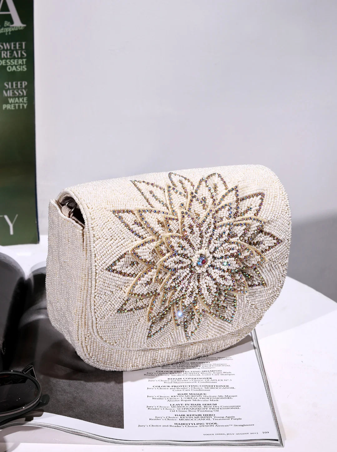 Eva White Flap Over Bag by The Tan Clan, stylish flap bag with white faux leather exterior and elegant design.