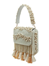 Embellished flap over bag by The Tan Clan featuring a stylish design, detailed embellishments, and a versatile flap closure.