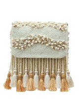 The Tan Clan Jena embellished flap-over bag with decorative details and structured design, featuring a stylish flap closure.