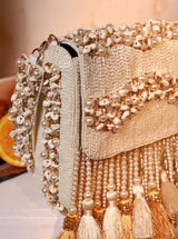 The Tan Clan Jena embellished flap-over bag with decorative details and a structured shape, perfect for stylish everyday use.