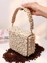 Tan Kate Flap Over Bag from The Tan Clan featuring a stylish flap design and adjustable shoulder strap.