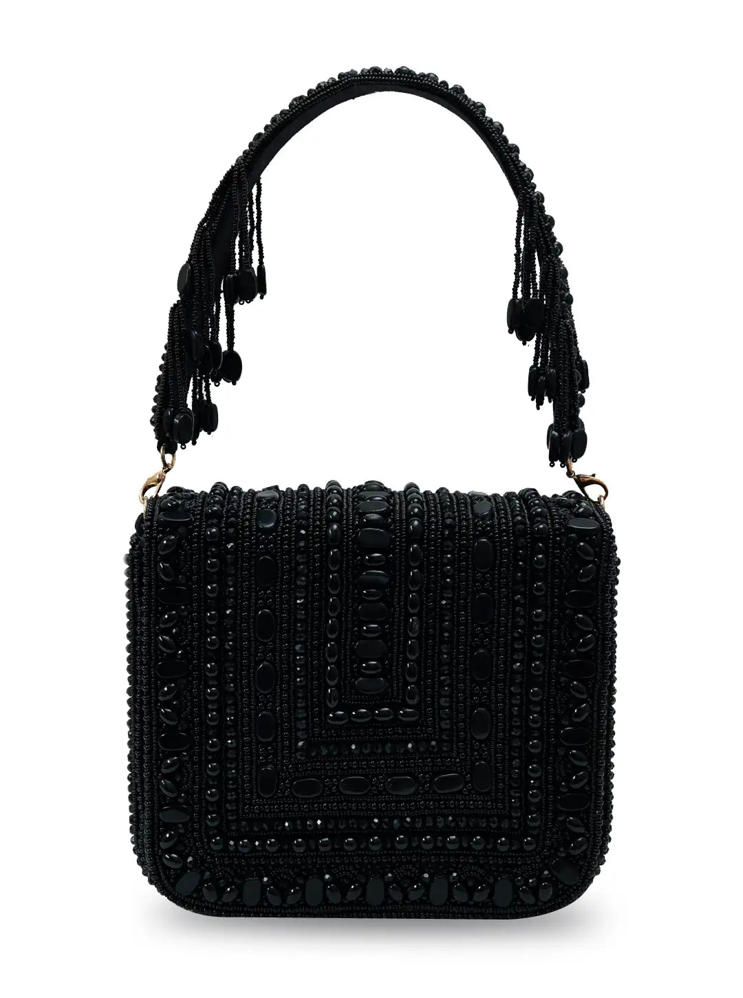 Black Megan flap-over bag by The Tan Clan featuring a sleek design and top flap closure, perfect for stylish everyday use.