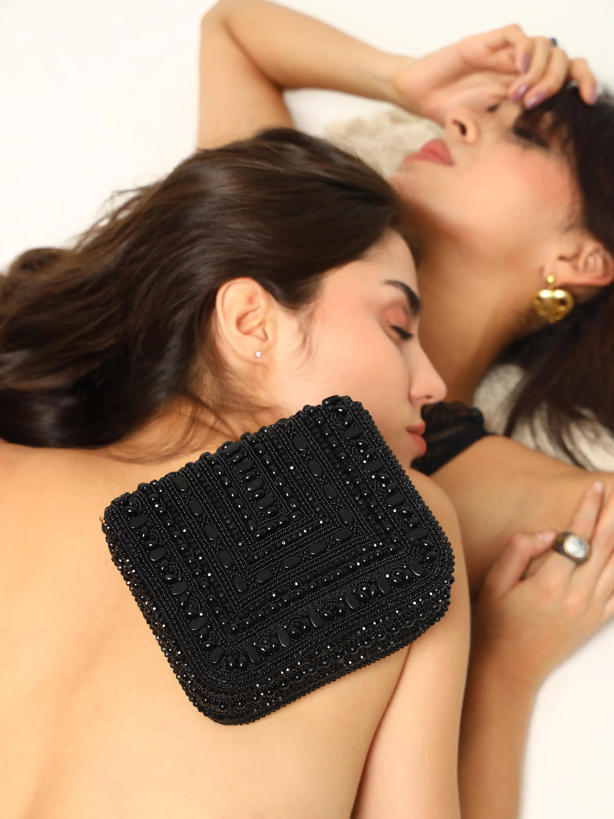 Black Megan flap-over bag from The Tan Clan, stylish flap bag with a sleek design and top handle, perfect for everyday use.