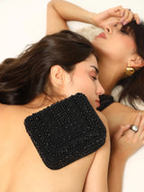 Black Megan flap-over bag from The Tan Clan, stylish flap bag with a sleek design and top handle, perfect for everyday use.