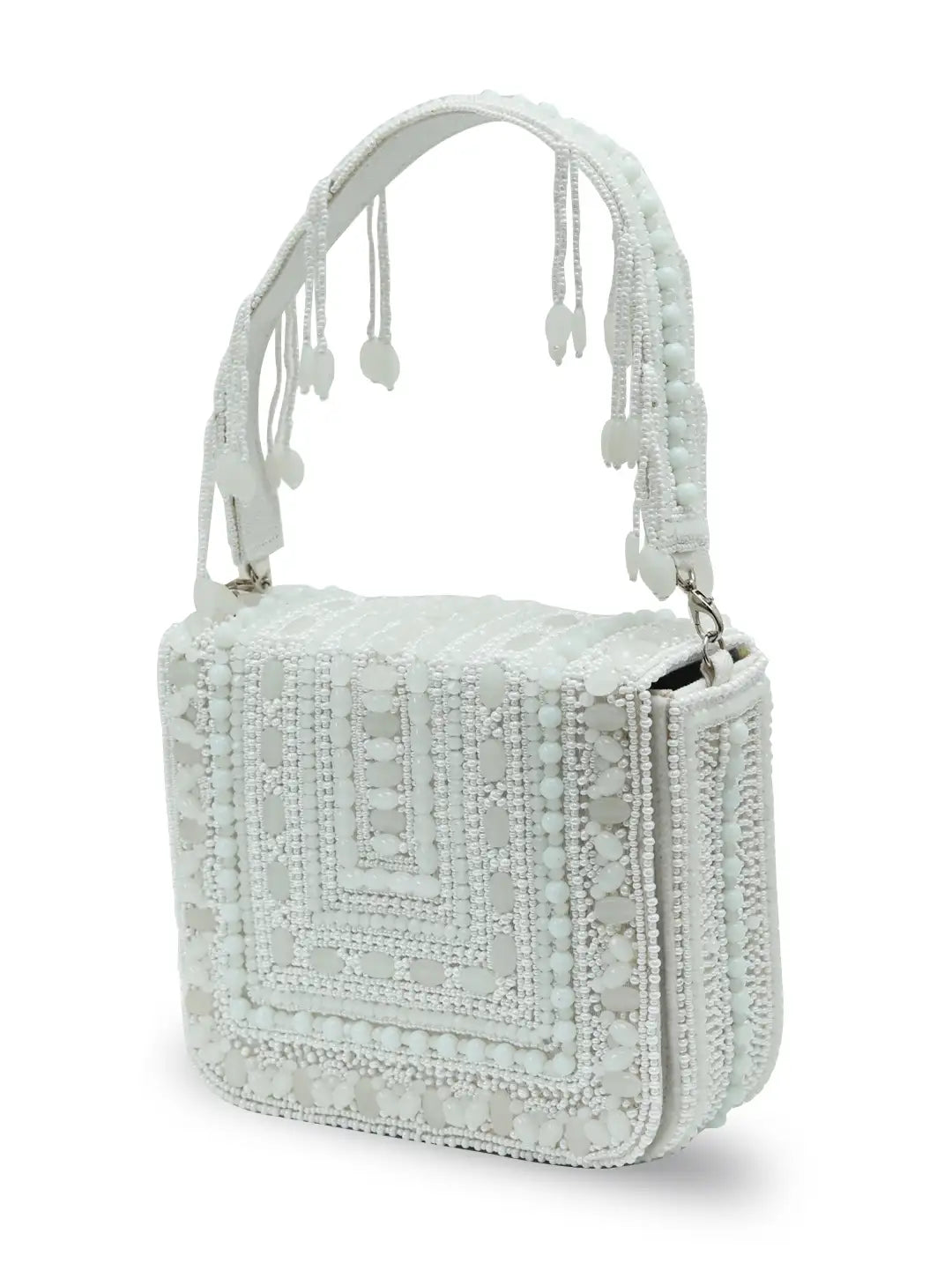 White flap over bag from The Tan Clan Megan collection, stylish leather handbag with silver hardware and adjustable strap.