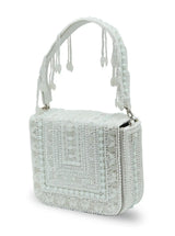 White flap over bag from The Tan Clan Megan collection, stylish leather handbag with silver hardware and adjustable strap.