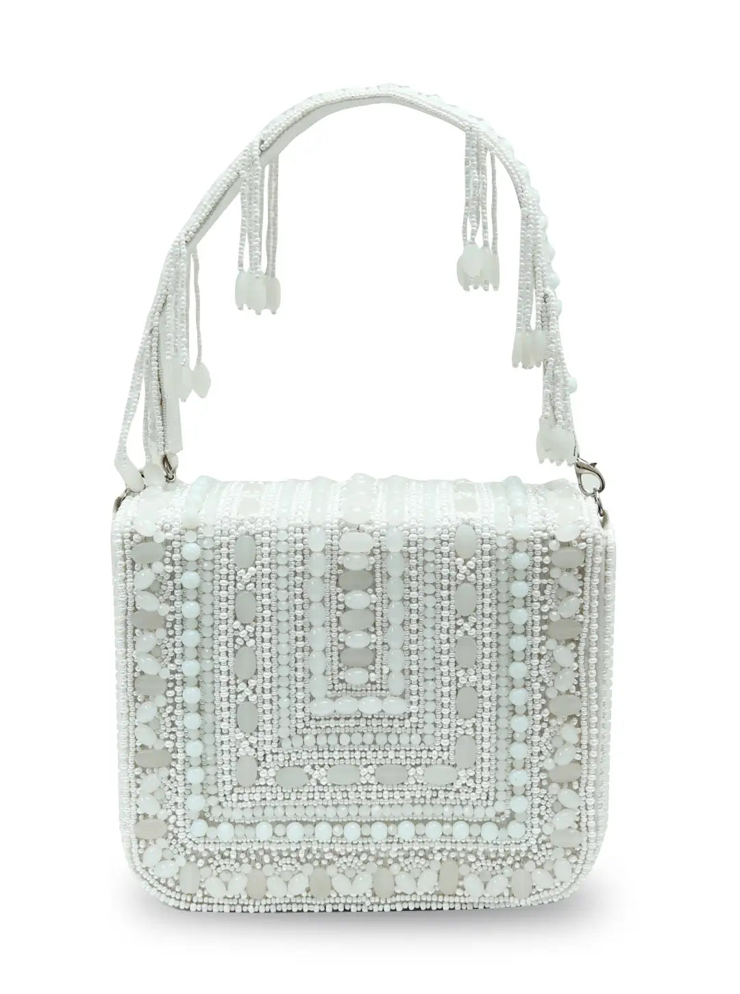 White Megan flap-over bag from The Tan Clan featuring a stylish flap closure and spacious interior.