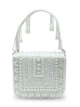 White Megan flap-over bag from The Tan Clan featuring a stylish flap closure and spacious interior.