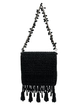 Mira black flap-over bag by The Tan Clan, stylish leather handbag with a flap closure and adjustable strap.