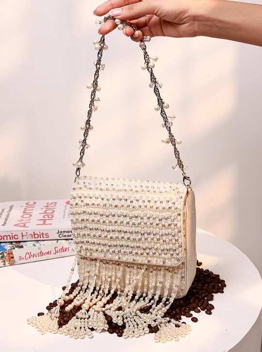 Mira White Flap Over Bag by The Tan Clan, a stylish flap bag with sleek design and spacious interior for everyday use.