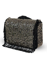 Black Sylvie flap-over bag from The Tan Clan featuring a stylish flap closure and spacious interior.