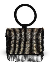 Black Sylvie flap-over bag by The Tan Clan featuring a sleek design with a flap closure and top handle.