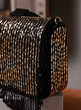 Black Sylvie flap over bag from The Tan Clan featuring a stylish flap closure and spacious interior, ideal for everyday use.