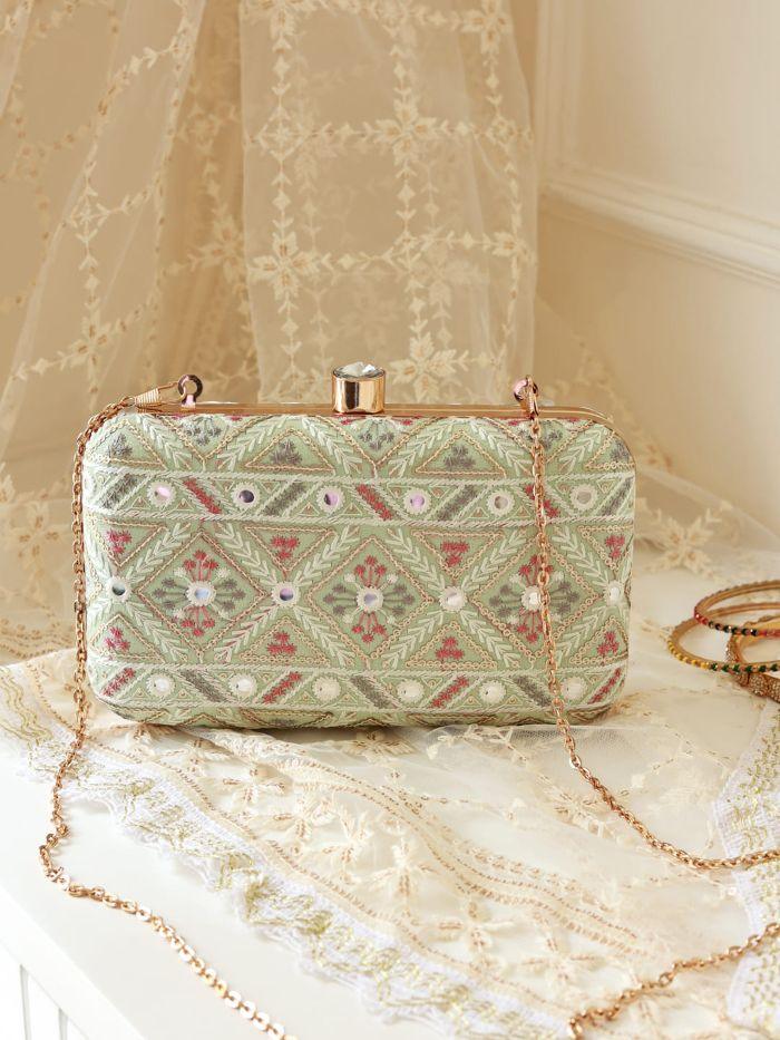Light green Ariba Box Clutch by The Tan Clan with sleek, structured design and compact size, perfect for elegant occasions.