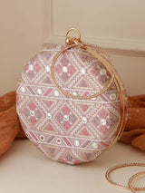 Pink round clutch bag by The Tan Clan, featuring a stylish and compact design with a smooth finish.