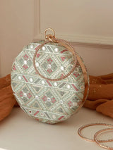 Pink round clutch bag from The Tan Clan's Ariba collection with a sleek design and compact shape.