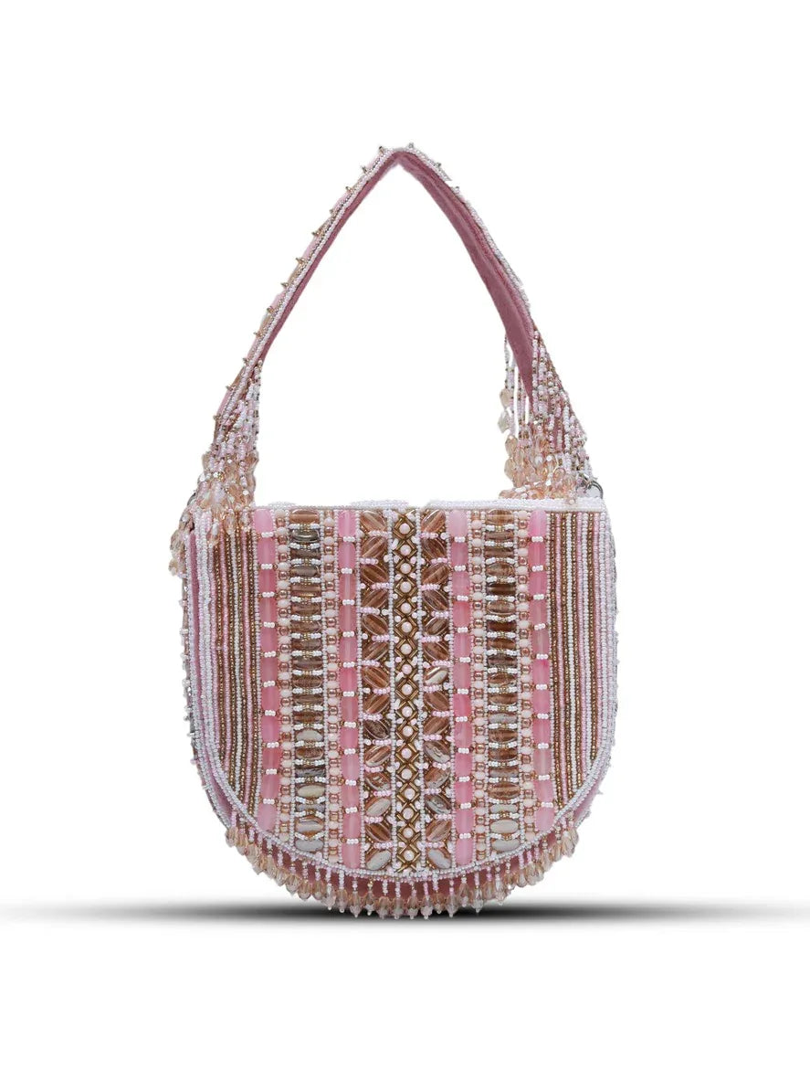 Pink Asma flap-over bag with handle by The Tan Clan, featuring a stylish design and secure flap closure.