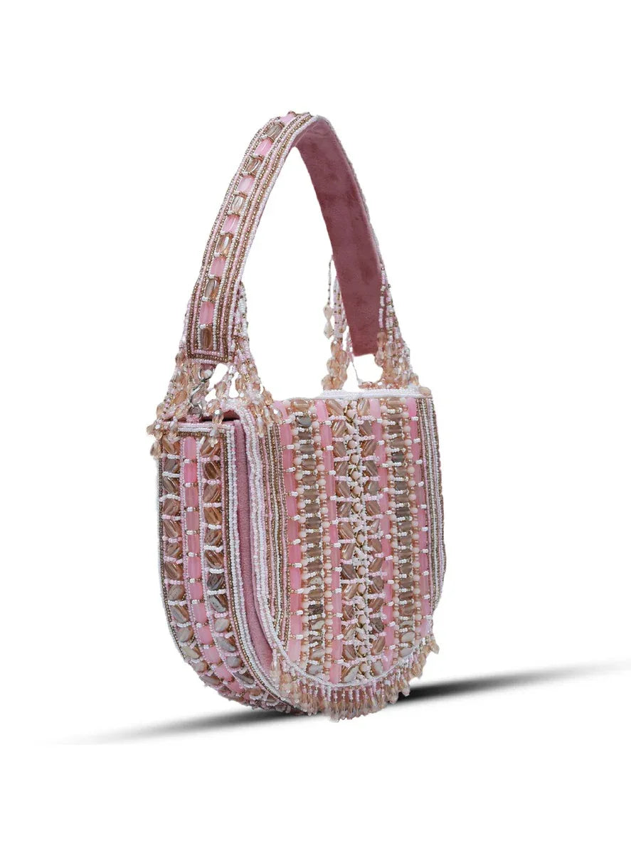 Pink Asma flap-over bag with handle by The Tan Clan, stylish and compact accessory for everyday use