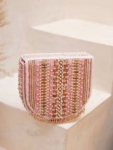 Pink Asma flap-over bag with handle by The Tan Clan, featuring a stylish exterior and convenient carrying handle.