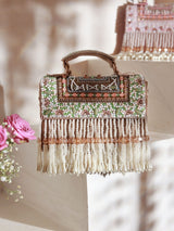 Beige Kiara flap-over bag with handle by The Tan Clan, featuring a stylish design and spacious interior.