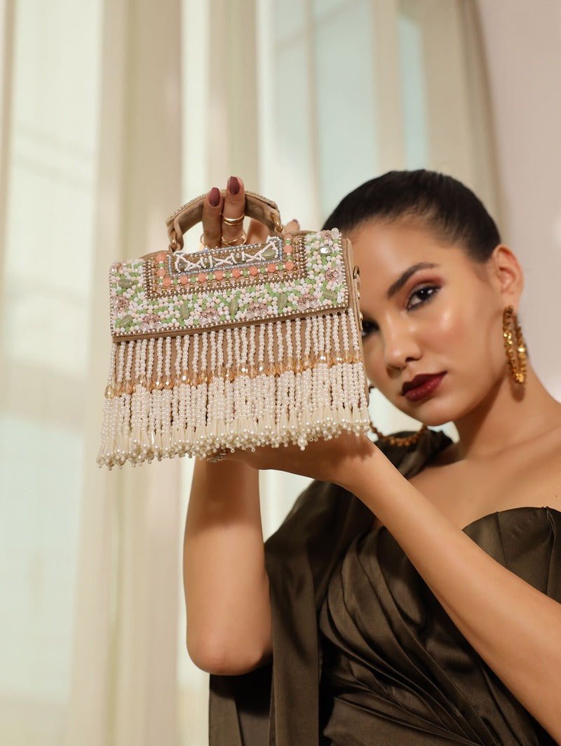 Beige Kiara flap-over bag with handle from The Tan Clan, featuring a stylish design and spacious interior.
