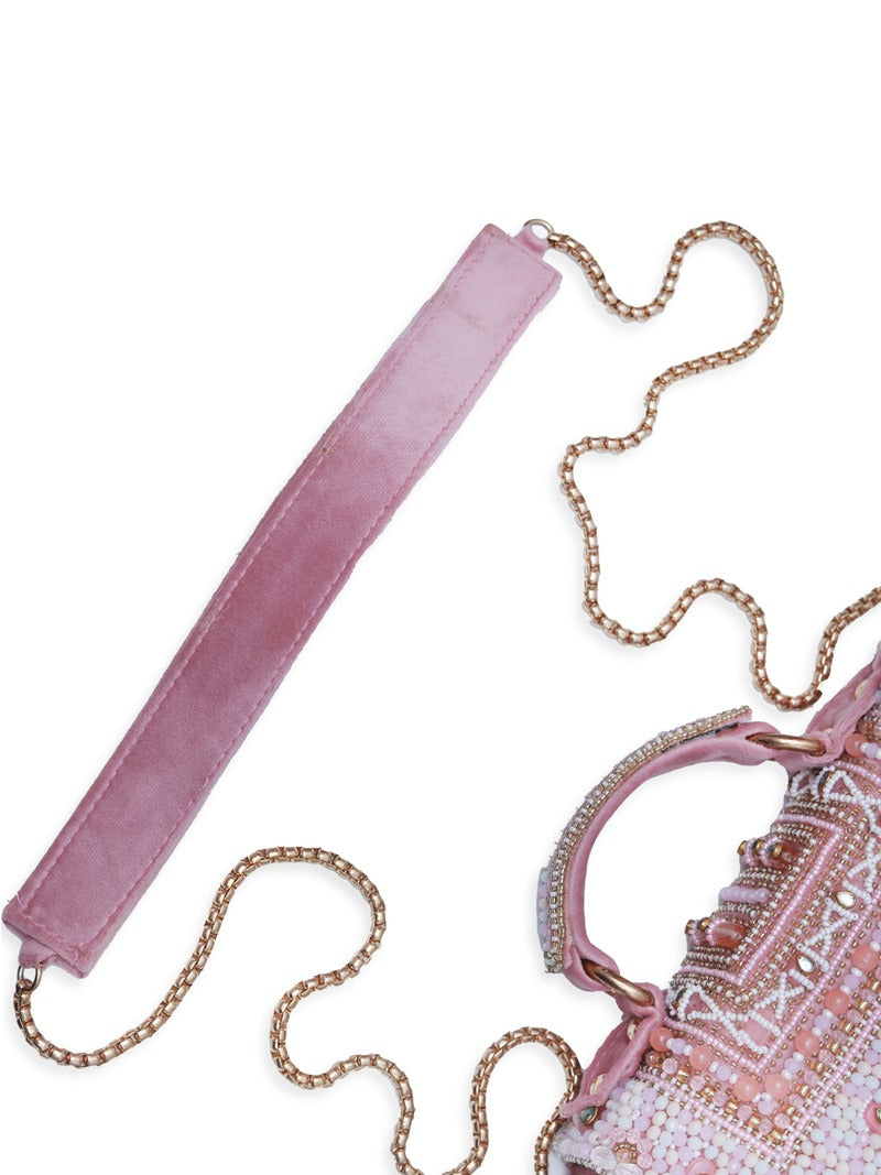 Pink Kiara flap-over bag with handle from The Tan Clan, showing its stylish design and soft leather material.